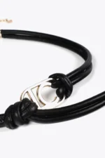 Faux leather strappy belt with oval logo black - Image 5
